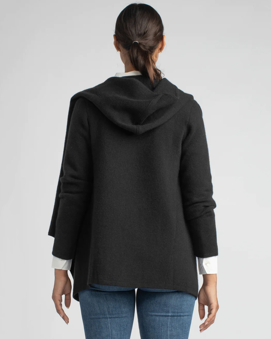 Woman from behind showcasing a dark gray St. Claire in Black cashmere cardigan and blue jeans by Margaret O'Leary.