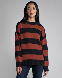 Woman in a Margaret O'Leary Chelsea Pullover in Spice Stripe posing against a neutral background.