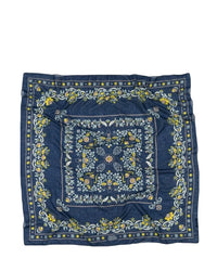 Maison Lecomte Flaments Secret Garden Cotton Bandana in Navy is a square cotton voile accessory with a blue background, floral pattern in yellow, green, and white, intricate borders, and a central motif.