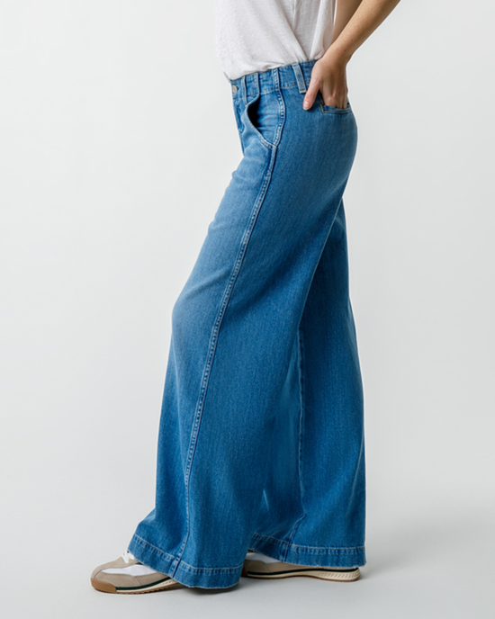 Person wearing AMO Edith Wide Leg Trouser in Amity standing against a plain background.