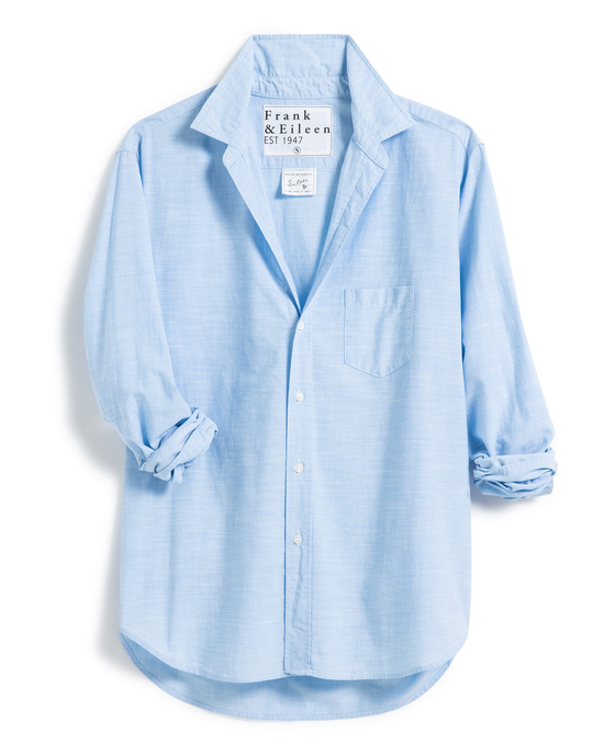 A relaxed fit, light blue Eileen Relaxed Button-Up Shirt in Blue Casual Cotton by Frank & Eileen on a white background, featuring a collar, long sleeves, and a front pocket.