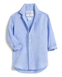 A light blue Frank & Eileen linen shirt with rolled-up sleeves and a visible brand tag on the collar, displayed on a white background.