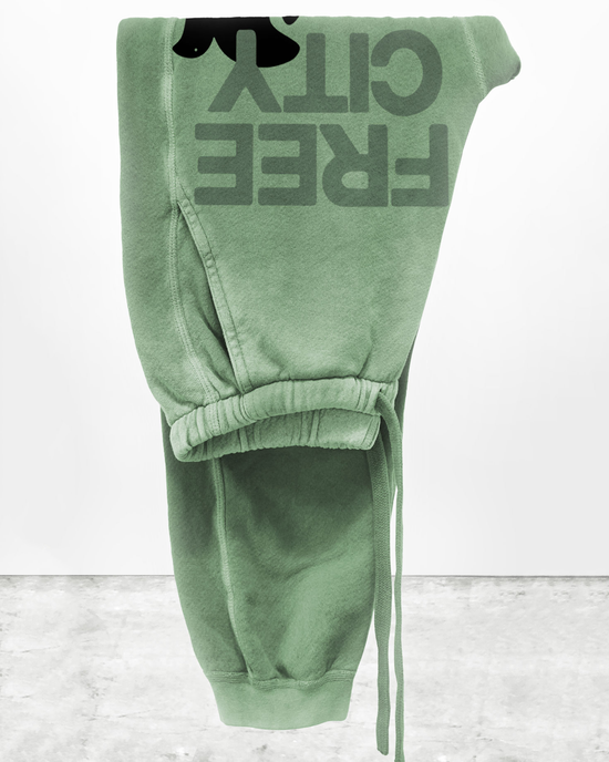 A pair of Large Sunfades Pocket Sweatpants in Joshua Tree by Free City, with "FREECITY" text turned upside down on a white background, featuring screen printed design.