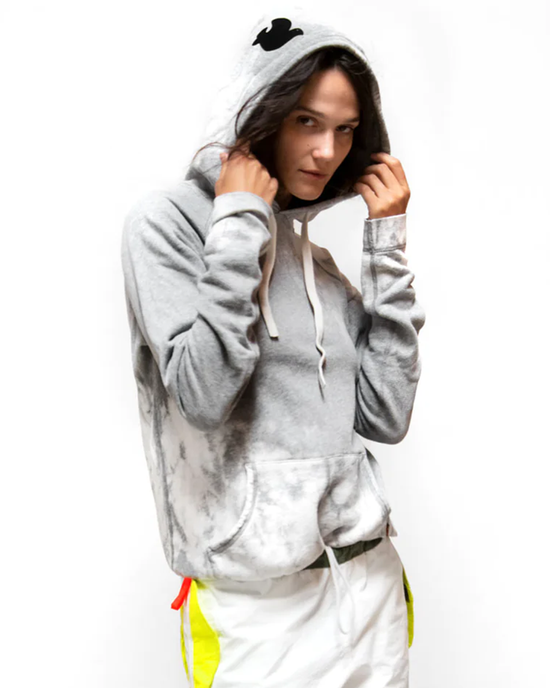 Person in a Free City Bleachout Pullover Hoodie in Heather Bleachout posing against a white background.