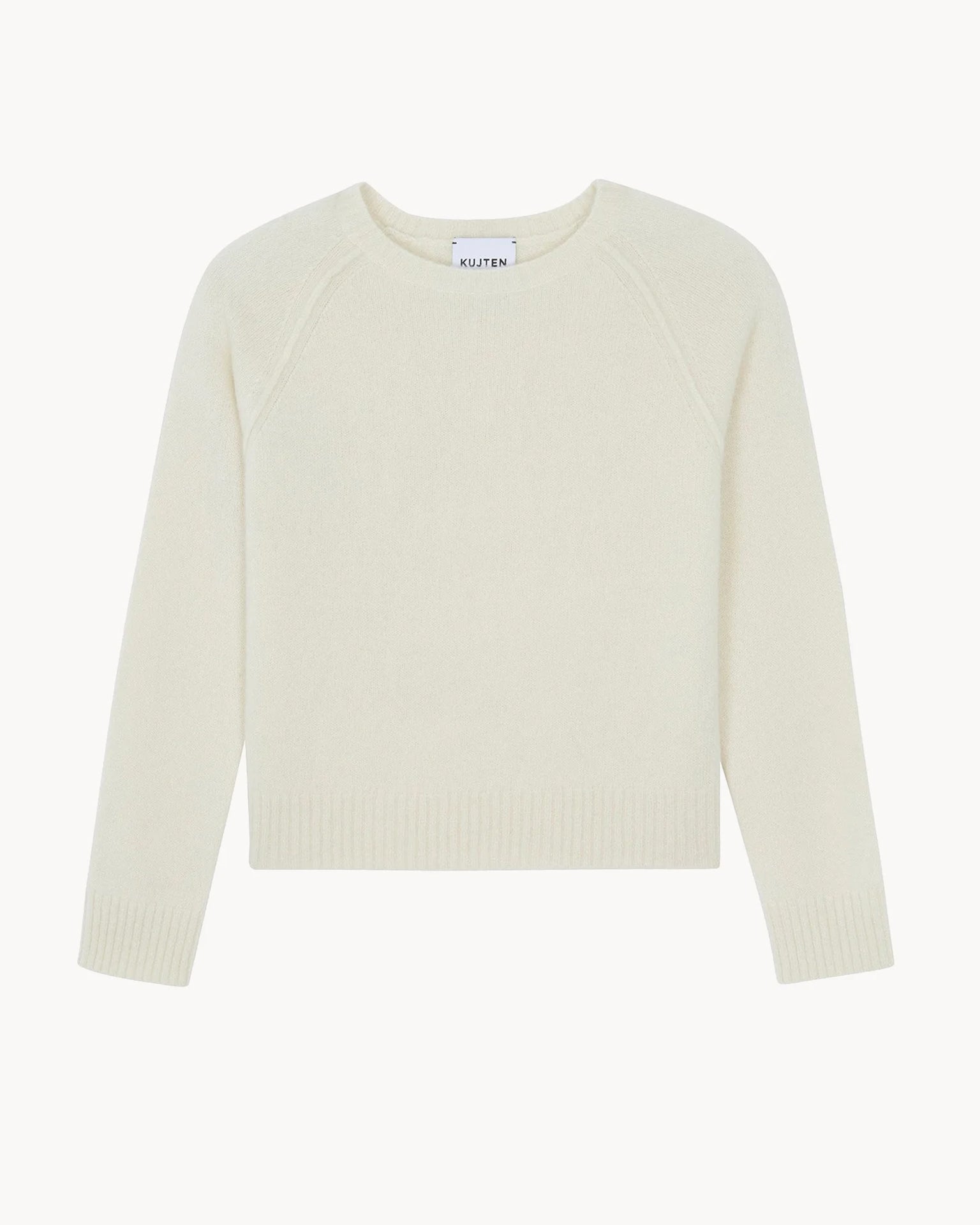 The Nimbus Crewneck in Blanc Vintage by Kujten is a slim, long-sleeved off-white cashmere sweater with a round neckline, ribbed cuffs, and ribbed hem, shown on a white background.