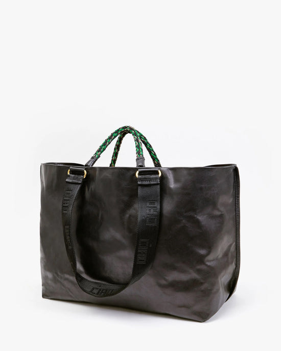 Grande Bateau Tote in Black New Look by Clare V. with green beaded handles and visible branding on fabric straps, isolated on a white background.