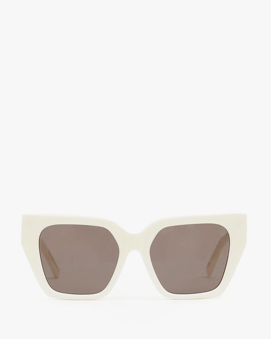 Heather Sunglasses in Cream by Clare V. with tinted lenses and UVA/UVB protection against a white background.