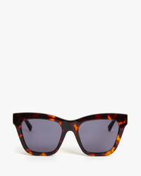 Pair of Clare V. Tortoise Sunglasses with 100% UVA/UVB protection and dark lenses against a white background.