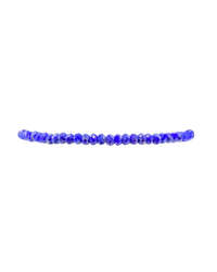 A strand of Karen Lazar Design's 2MM Sig Bracelet with Lapis & Yellow Gold gemstones arranged in a straight line on a white background.