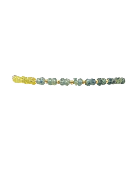 A row of 2MM Sig Bracelet with Laguna Ombre & Yellow Gold beads, including sapphire gemstone pattern and 14k Yellow Gold filled beads, against a white background by Karen Lazar Design.