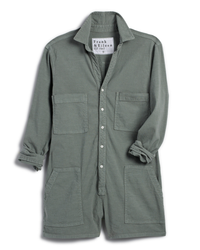 A green, button-up work jacket with four front pockets and a relaxed fit, displayed on a white background. Ireland L/S Playsuit in Rosemary by Frank & Eileen.