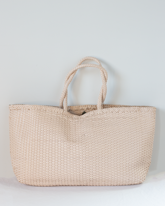 The Shopper Bag - Max in Peachy Natural by Dragon Diffusion, featuring two braided handles, is displayed against a plain light background.