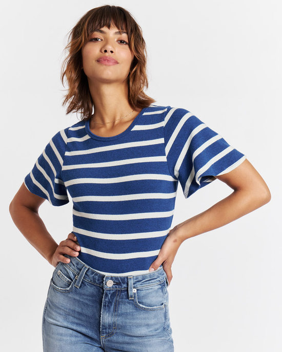 Woman posing in a nautical printed AMO Sylvie Tee in Natural/Navy with her hands on her hips.