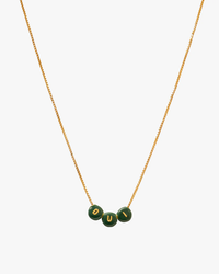 A Clare V. Letter Bead Necklace in Evergreen/Gold with three green stones on a white background.