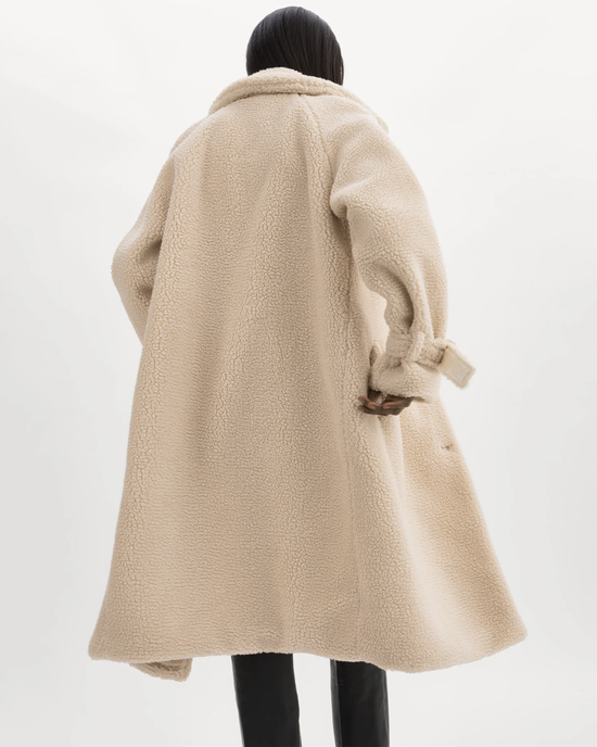 Person from behind wearing an oversized Lamarque Malani Jacket in Beige with a hood.