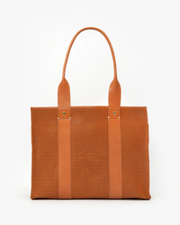 Noemie in Cuoio Perf Clare V. tote bag with perforated leather straps against a white background.