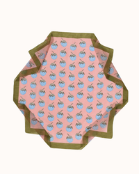 A pink and green square Botanica Strawberries Bandana in Rose tablecloth with a pineapple pattern, created using the hand screen print process by Épice.