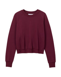 The Alexi French Terry Sweatshirt in Dark Burgundy by perfectwhitetee features long sleeves, ribbed cuffs and waistband, a crew neckline, and soft fabric, shown laid flat on a white background.