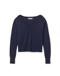 The Georgina Cashmere V Neck Sweater in Navy by perfectwhitetee features long sleeves, a cropped fit, ribbed cuffs and hem, and is displayed against a white background.