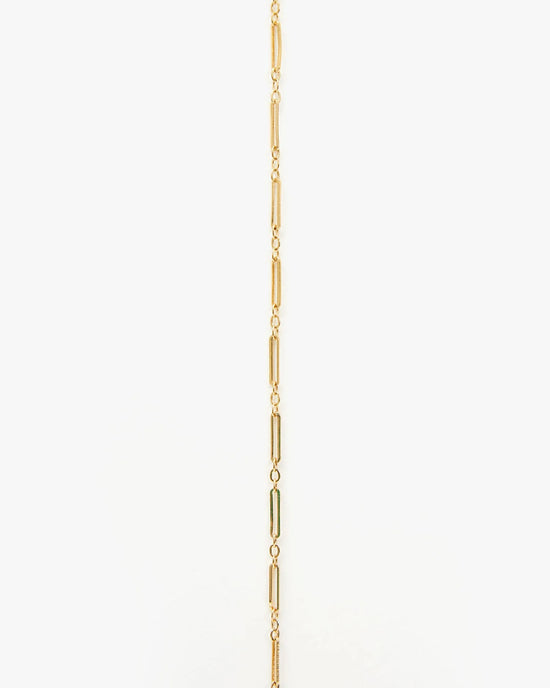 The Clare V. Fine Paperclip Charm Chain 24" in 14K Gold Vermeil features elongated oval and small round links, shown vertically on a plain white background.