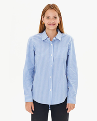 Woman in a tailored fit, Clare V. Phoebe Blouse in Blue & Cream Stripe, smiling at the camera.
