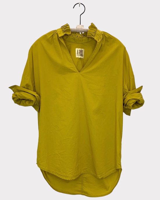 Penelope - Cabo - Chartreuse Pop Over blouse with ruched shoulders and rolled-up sleeves displayed on a hanger by A Shirt Thing.