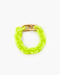 Neon yellow resin link bracelet with double carabiner closure from Clare V.