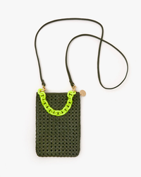 Crocheted shoulder bag with neon green strap and Clare V. Resin Link Bracelet in Neon Yellow against a white background.