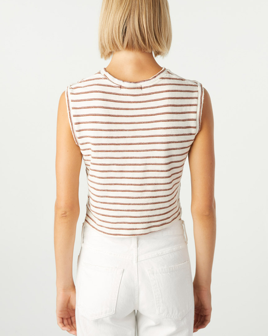 Woman wearing a striped Sleeveless Babe Tee in Bone and white AMO denim pants, photographed from behind.