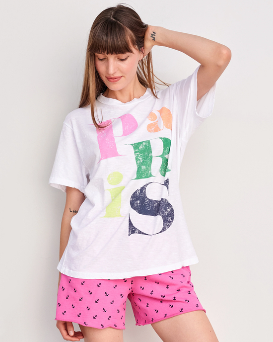 Woman posing in a Sundry Paris Boyfriend Tee in White and pink printed shorts.