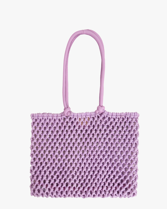 Sandy in Lilac woven tote bag by Clare V. isolated on a white background.