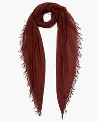 A Chan Luu Cashmere & Silk Scarf in Fired Brick with fringed trims on a white background.