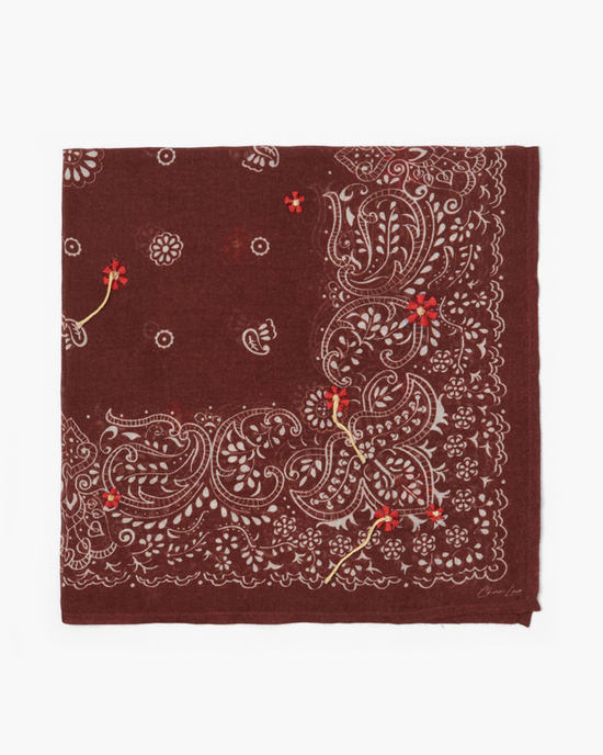 A red Chan Luu Floral Bandana in Fired Brick with a paisley and floral print.
