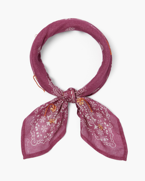 A purple Chan Luu Floral Bandana in Rose Sorbet with lace patterns tied in a knot, isolated on a white background.