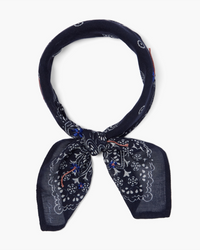 Dark Sapphire Chan Luu floral bandana with paisley pattern tied in a knot on a white background.