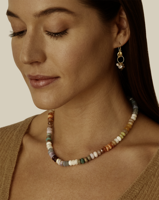 Woman wearing a multicolored beaded Chan Luu CL Necklace NG-14657LQ in Multi and a dangling earring.