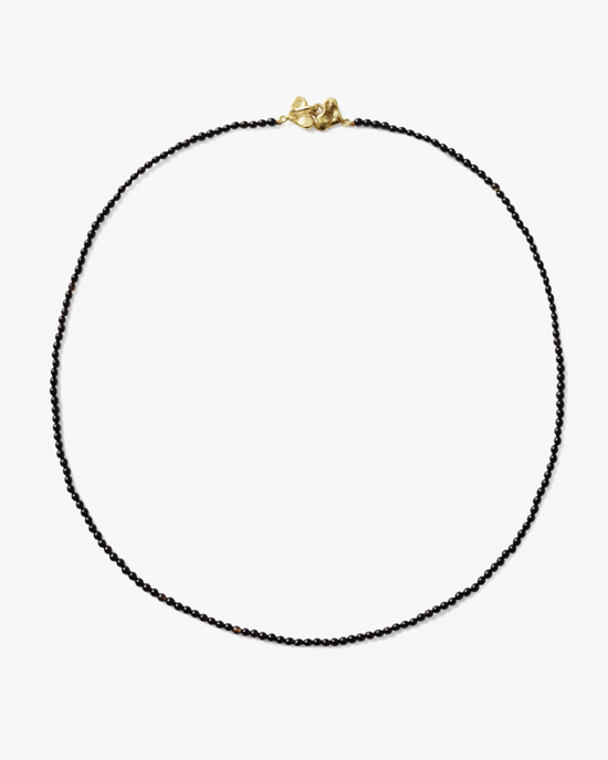 Chan Luu's Onyx Beaded Merida Necklace with an 18k gold-plated sterling silver clasp on a white background.