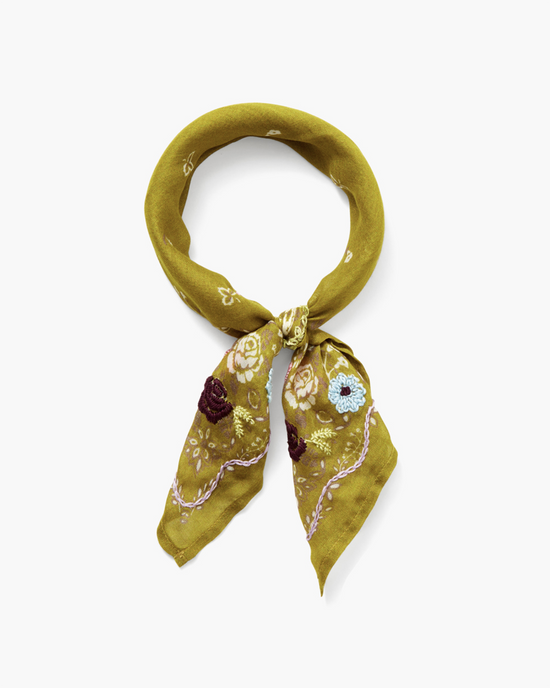 Mustard yellow viscose gauze Lrg Emb Flower Bandana in Green with floral print, neatly tied in a knot, displayed on a white background by Chan Luu.