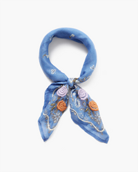 A Chan Luu periwinkle Lrg Emb Flower Bandana with floral embroidery and bead accents, tied in a knot, isolated on a white background.