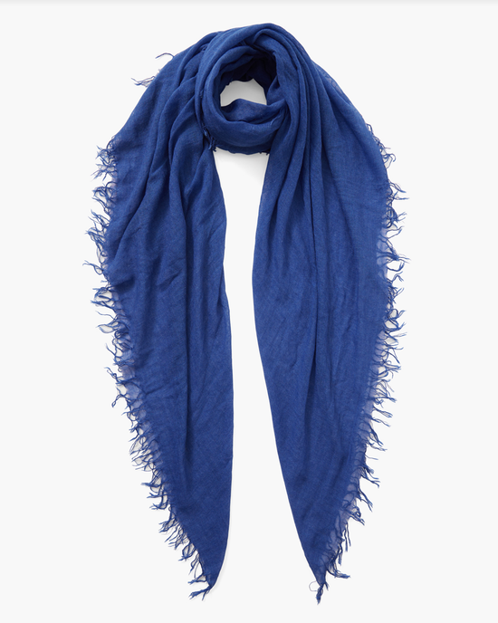 A vibrant Chan Luu Cashmere & Silk Scarf in Blue with frayed edges, displayed on a white background.
