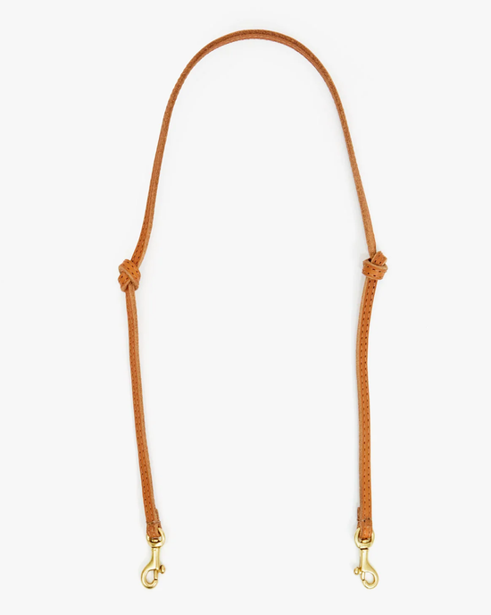 Thin Knotted Shoulder Strap in Cuoio by Clare V. with gold-tone clasps on a white background.