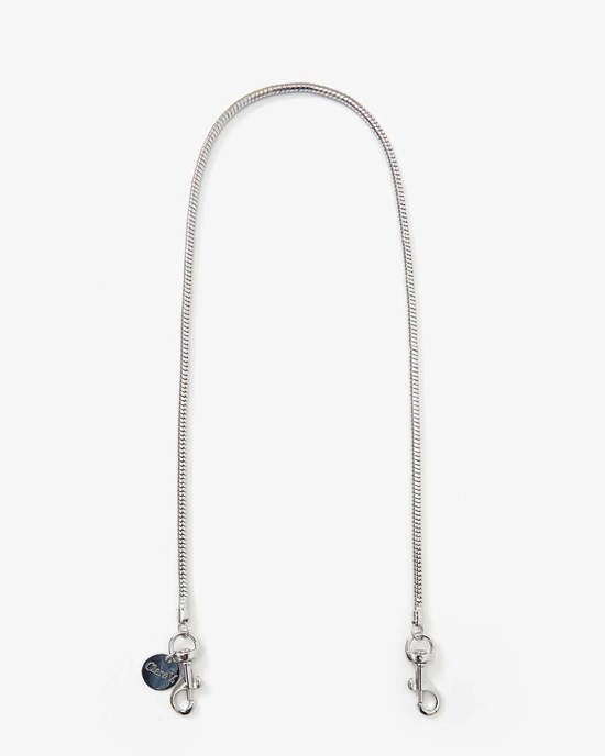 Clare V. Silver snake chain shoulder strap with lobster clasps and a blue heart charm.