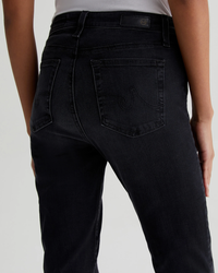 A close-up view of the back of a pair of dark AG Jeans, focusing on the high-rise straight-leg pocket and waistband of the Mari in City View jeans.
