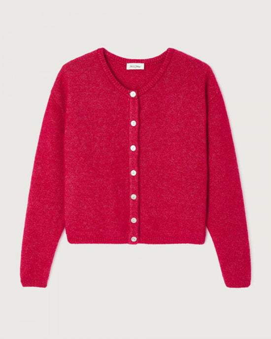 The Vito Cardigan in Magenta Chine by American Vintage is a cropped wool style with a round neckline, white front buttons, and ribbed hem and cuffs, shown laid flat on a light background.