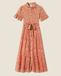 The Martine Dress in Vermillion Vine by Trovata Birds of Paradis features short sleeves, a collar, waist tie, and a flowing tiered maxi skirt with a red and beige floral pattern.