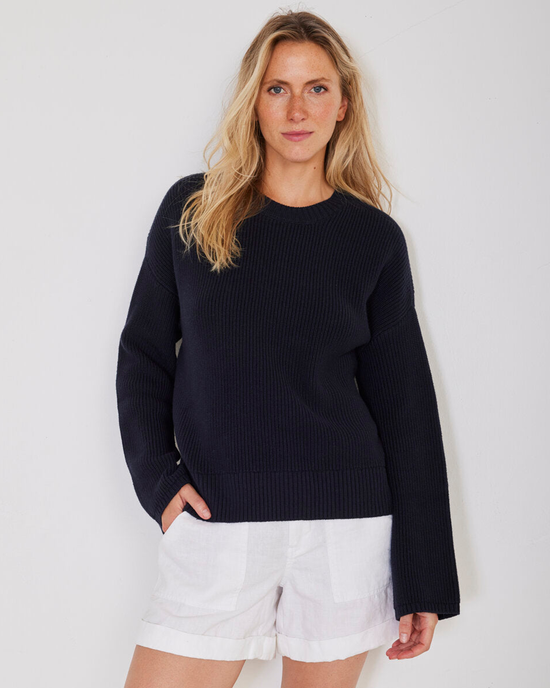 Woman in a Simon Fisherman Crewneck in Navy and white shorts posing for the camera by Not Monday.