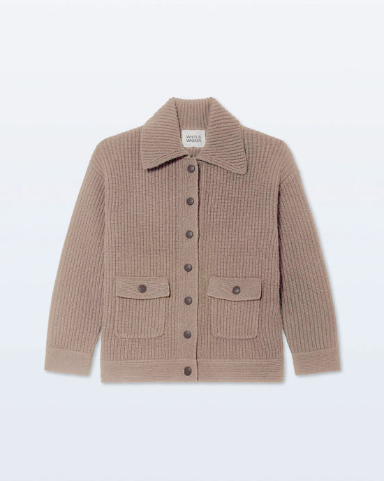 The Merino Fisherman Jacket in Macadamia by White + Warren features a beige ribbed knit, collar, button-down front, long sleeves, and two front pockets with buttoned flaps, crafted from soft Scottish merino wool.