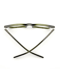 A pair of green-rimmed CADDIS Bixby Reading Glasses in Heritage Green positioned upside down against a white background, forming an "x" shape with their temples.