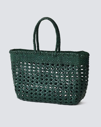 Dark green Cannage Kanpur Big tote by Dragon Diffusion against a neutral background.