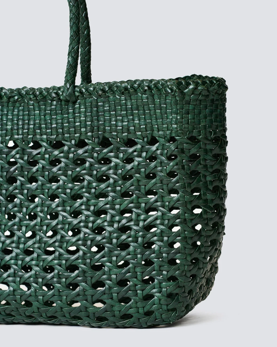 Cannage Kanpur Big in Forest Green handwoven leather tote bag by Dragon Diffusion against a white background.